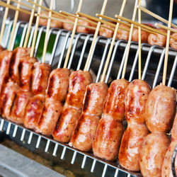 High angle view of meat on barbecue grill