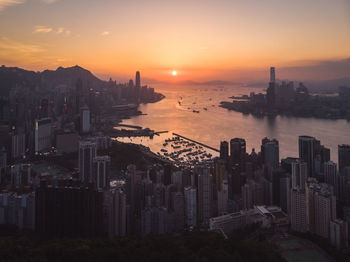 High angle view of city buildings during sunset