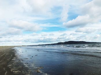 Scenic view of beach against sky