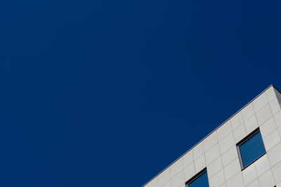 Low angle view of built structure against clear blue sky