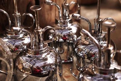 Shiny metallic bottles on table