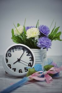 Close-up of purple flower vase on table