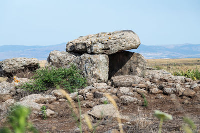 Rock formation on land against sky