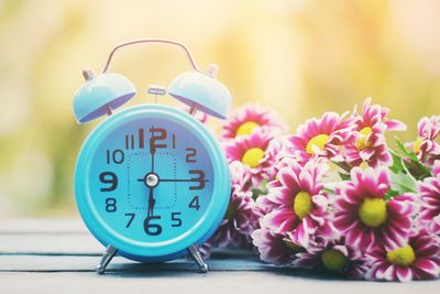 Close-up of clock on table