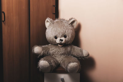 Vintage teddy bear stuffed toy alone in room