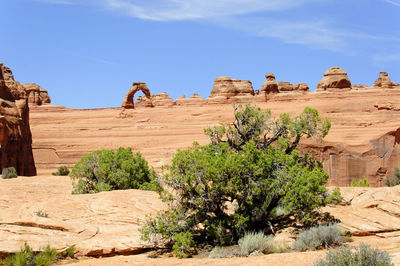 View of rock formations on landscape against sky