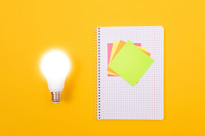 Close-up of yellow light bulb