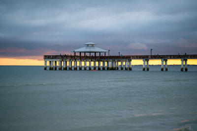 Pier over sea against sky