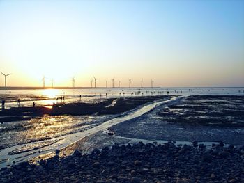 Scenic view of sea against clear sky during sunset