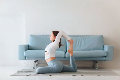 Man sitting on sofa at home