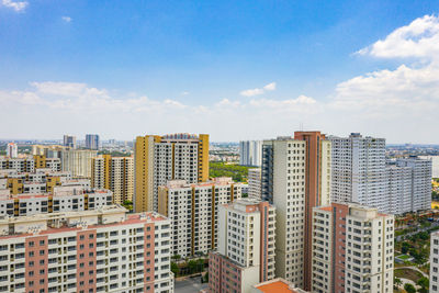 Buildings in city against sky