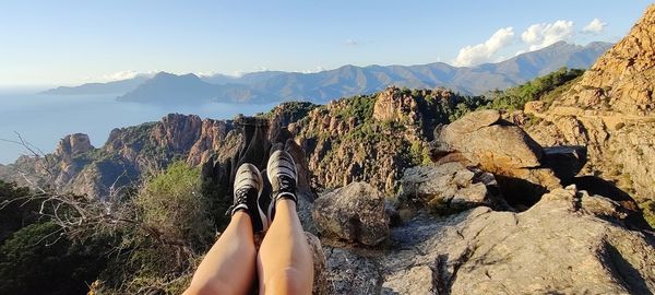 Scenic view of rocks in mountains against sky