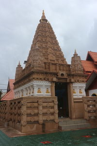 Historic building against cloudy sky