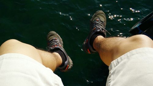 Low section of people against sea