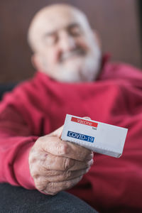 Midsection of woman holding paper currency