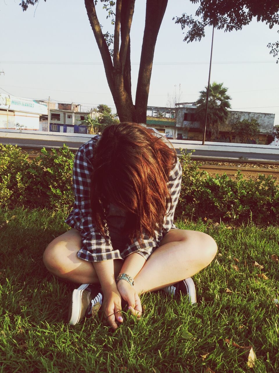 lifestyles, leisure activity, grass, long hair, childhood, person, girls, young women, full length, rear view, casual clothing, park - man made space, tree, elementary age, brown hair, young adult, field