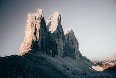 Rock formations on mountain against sky