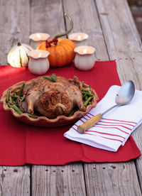 High angle view of roast chicken in container on table