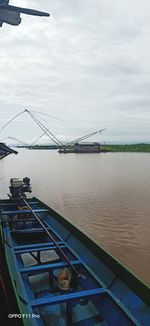 Bridge over river against sky