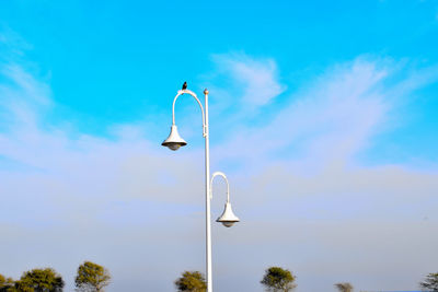 Low angle view of street light against sky