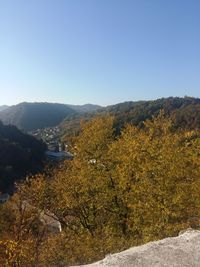 Scenic view of landscape against clear sky during autumn