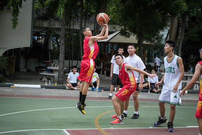 Group of people playing basketball