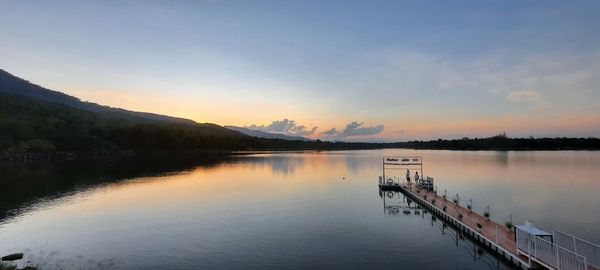 Scenic view of lake against sky during sunset