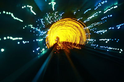 Illuminated ferris wheel at night