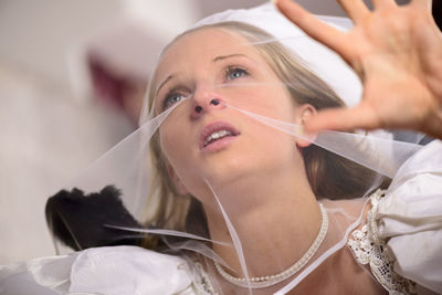 Close-up of young woman at home