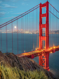 Golden gate bridge over sea against sky