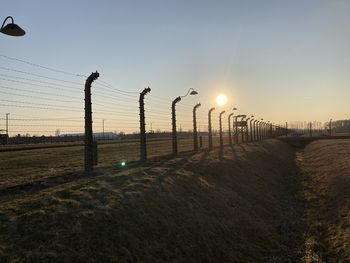Scenic view of field against sky during sunset