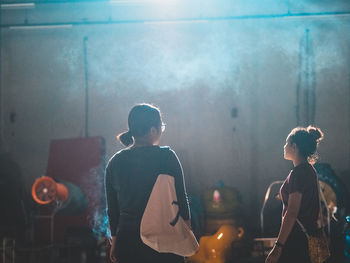 Side view of people at night