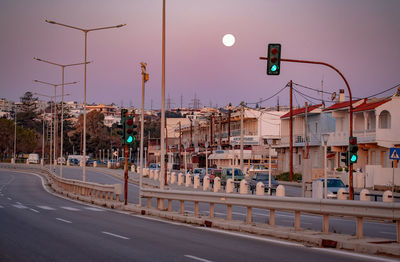 View of traffic on road at dusk