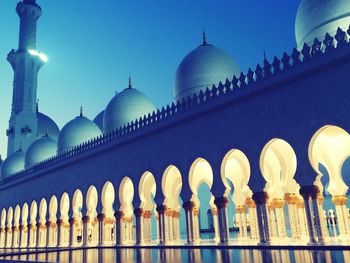 Low angle view of mosque against clear sky