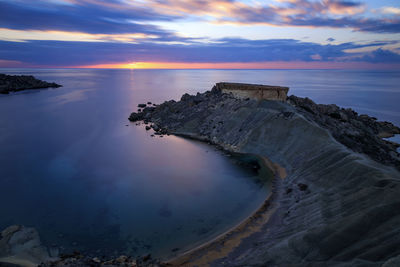 Scenic view of sea against sky at sunset