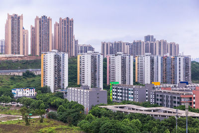 Modern buildings in city against sky