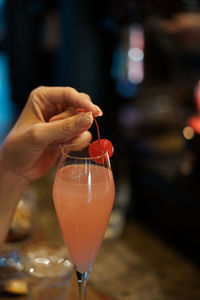 Midsection of woman holding drink