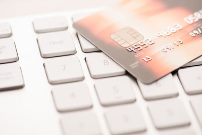 Close-up of credit card on computer keyboard