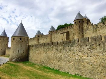 Historic building against cloudy sky