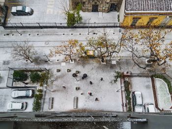 Scenic view of frozen lake by building in city