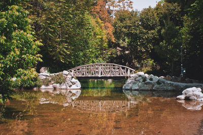 Footbridge over canal at park during autumn