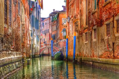 Bridge over river with city in background