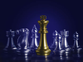 Close-up of chess pieces against black background