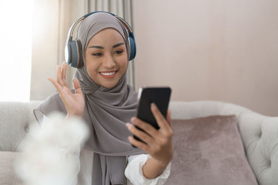 Young woman using mobile phone