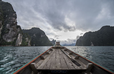 Scenic view of sea and mountains against sky