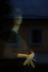 Woman looking at window