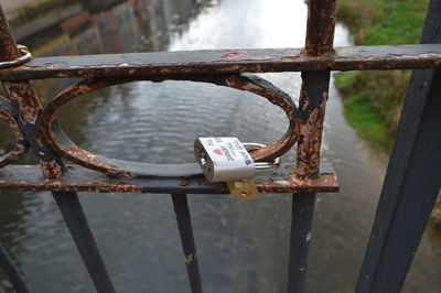 Close-up of padlock on railing