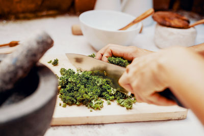 Production of parsley herb salt in a mortar