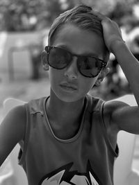 Portrait of young woman wearing sunglasses