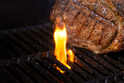 Close-up tomahawk being grilled on the grill
